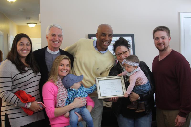 Geoff Worrell, center, stands with friends and family after a Habitat for Humanity home was dedicated in his wife's honor for her volunteer efforts. Cindy Worrell passed away last year. BY MATTHEW BERNAT